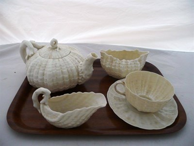 Lot 14 - A Belleek tea set, comprising teapot and lid, cup and saucer, jug and bowl