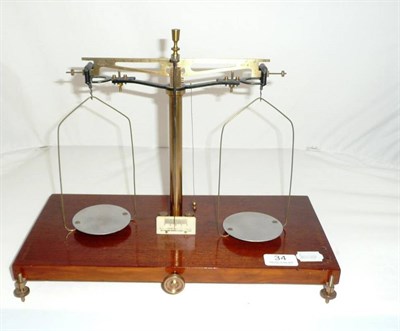 Lot 34 - A set of precision balance scales on a mahogany plinth by Henri Louis Becker of Brussels