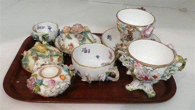 Lot 37 - A Meissen floral encrusted cup and saucer, another smaller, a pair of Rockingham type flower...