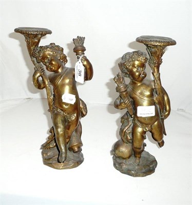 Lot 38 - Pair of gilt metal cherub candlesticks