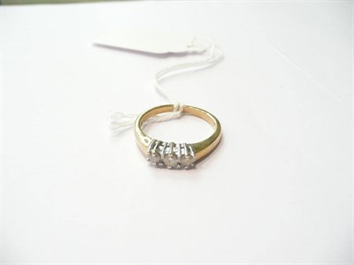 Lot 57 - A diamond three stone ring