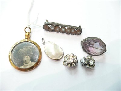 Lot 67 - A picture locket, a bar brooch, an amethyst brooch, a blister pearl pendant and a pair of paste...