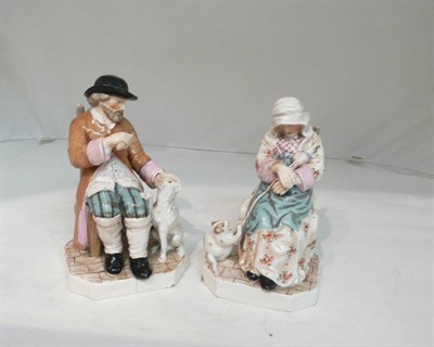 Lot 82 - A pair of Staffordshire seated figures, man with dog and woman asleep with playful cat (a.f.)