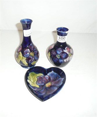 Lot 100 - Two small Moorcroft vases (one chipped) and a Moorcroft heart shaped dish (3)