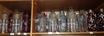 Lot 111 - Two shelves of assorted cut and painted glass shades