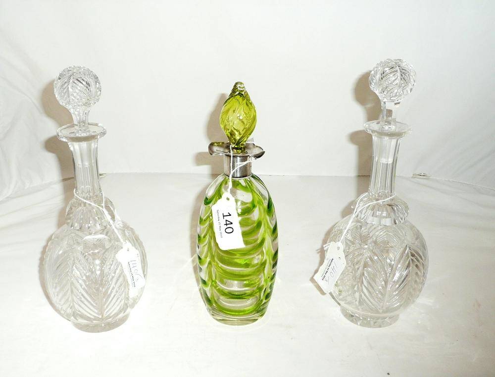 Lot 140 - Pair of Whitefriars cut glass decanters and stoppers and green glass decanter and stopper with...