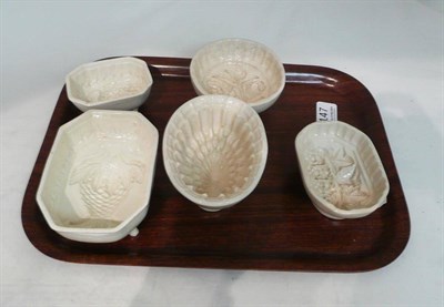 Lot 147 - Two early 19th century creamware moulds and three others