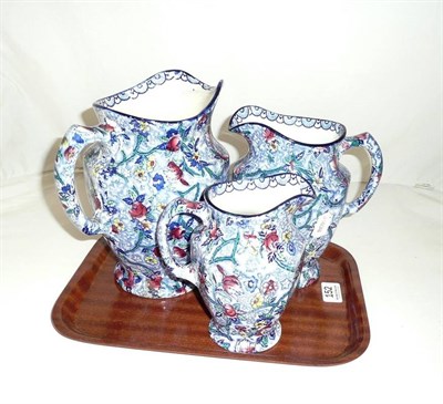 Lot 152 - A graduated set of three Maling Rington's jugs