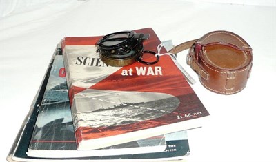 Lot 237 - A First World War military compass in stitched leather case and four military booklets