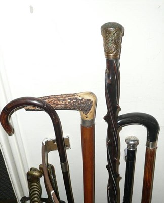 Lot 263 - Five assorted walking sticks including a measuring stick