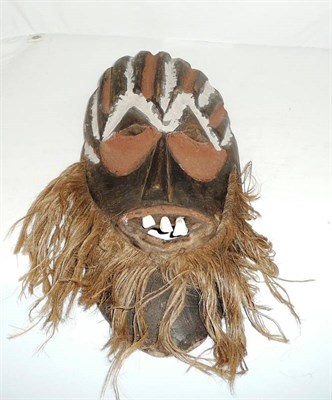 Lot 293 - A Ndacka, D.R.Congo Wood Mask, the deep furrowed brow and eyes sockets highlighted in ochre and...