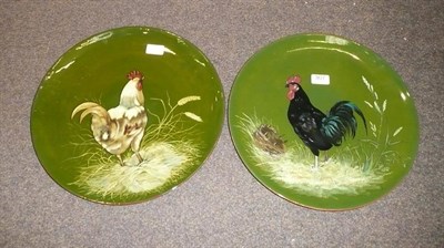 Lot 307 - A pair of Mintons terracotta chargers decorated with chickens, retailed by T.Goode & Co., London