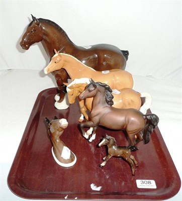 Lot 308 - Beswick horse 'Burnham Beauty', matt brown horse, two Palomino horses, brown foal and a horse...