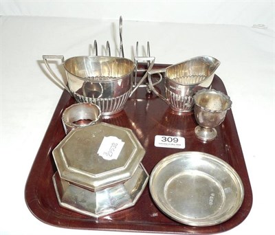 Lot 309 - A silver inkwell, London 1910, a silver cream jug and sugar bowl en suite, Sheffield 1909,...