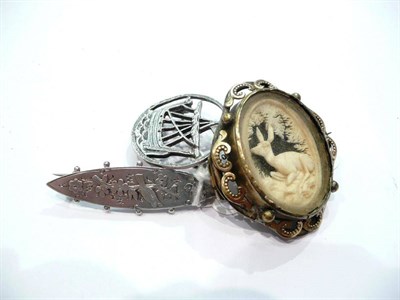 Lot 330 - A Victorian silver brooch, a carved brooch and an Iona silver brooch