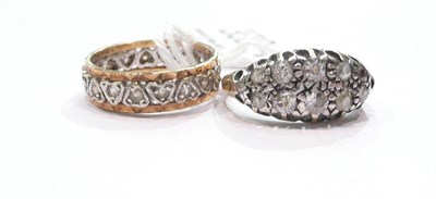 Lot 352 - A diamond cluster ring (one stone missing) and an eternity ring