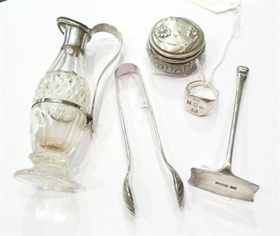 Lot 356 - A silver mounted bottle, silver nips, silver pusher, silver ring and pill box (5)