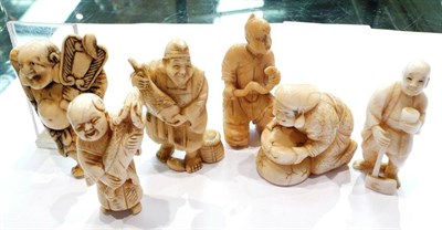 Lot 360 - Five carved ivory netsukes and a small figure with a serpent