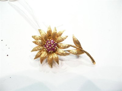 Lot 366 - An 18ct gold ruby set flower brooch