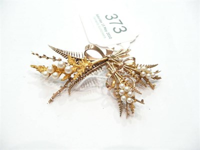 Lot 373 - A 9ct gold brooch and pair of earrings in the form of tied bouquets set with small pearls