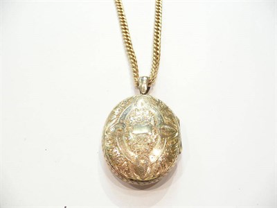 Lot 375 - An 18ct gold albert chain with gilt locket suspended