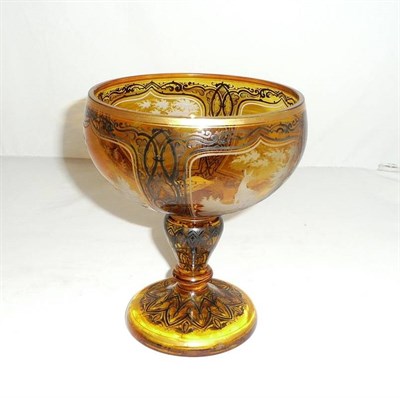 Lot 383 - A Bohemian amber flash glass pedestal bowl, circa 1850-70,  the circular bowl with four arched...