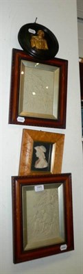 Lot 395 - Pair of framed relief plaques, metal mounted relief portrait and another framed relief...