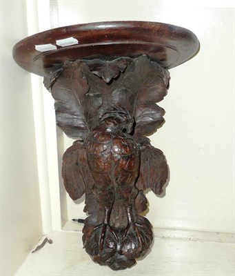 Lot 401 - A carved oak wall bracket