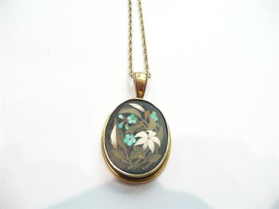 Lot 412 - A pietra dura locket back pendant on chain