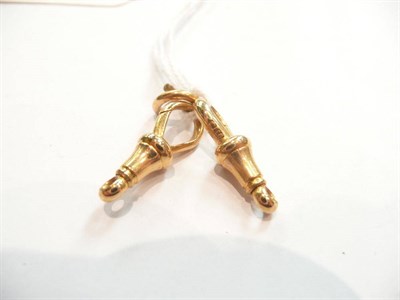 Lot 427 - Two 18ct gold swivel catches and a jump ring