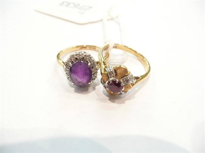 Lot 440 - A ruby and diamond cluster ring and an amethyst and diamond cluster ring (2)