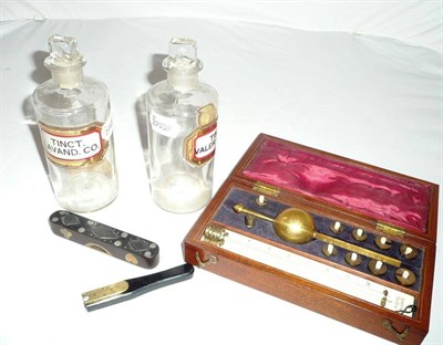 Lot 460 - Syke's Hydrometer, and a quill cutter, a spirit level and two medicine bottles