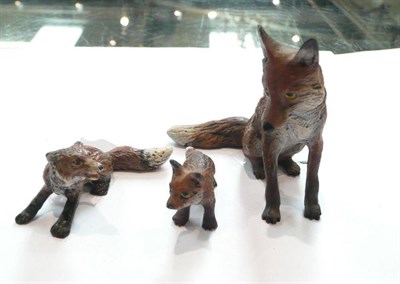 Lot 472 - Three cold painted bronze foxes