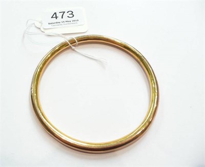 Lot 473 - A 9ct gold slave bangle