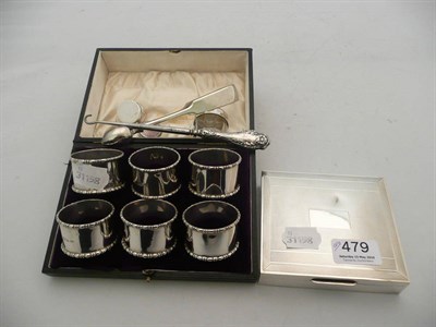 Lot 479 - Six cased silver napkin rings, silver cigarette case, silver button hook, tongs, pill boxes etc