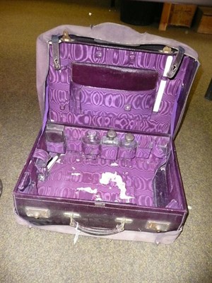 Lot 520 - Purple Harrods leather-fitted travelling case with silver-mounted fittings