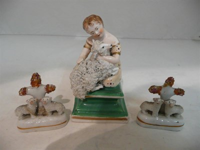 Lot 527 - A 19th century Staffordshire porcelain figure of a girl and sheep and two miniature...