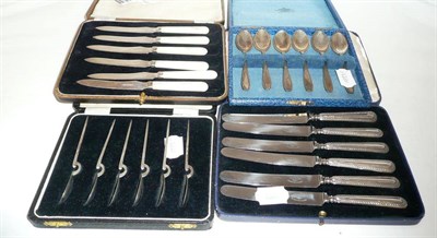 Lot 549 - Two cases of silver knives and two cases of silver teaspoons