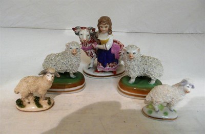 Lot 550 - A pair of Dresden sheep, another single, a girl with ram, probably continental, and a single...