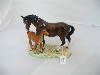 Lot 587 - Beswick horse and foal on pottery plinth