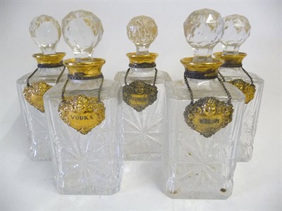 Lot 1 - A Set of Five Cut Glass Square Section Shouldered Decanters, by Asprey, London 1963, with...