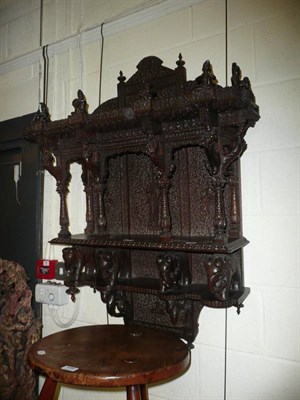 Lot 697 - Carved Burmese hardwood shelf