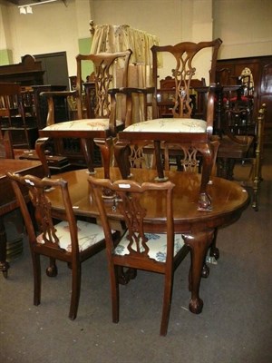 Lot 742 - Mahogany dining table with six chairs on claw and ball feet