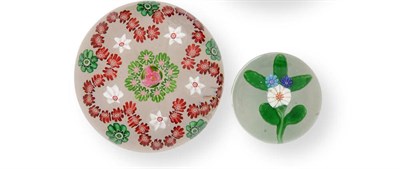 Lot 9 - A Clichy Garland Paperweight, circa 1850, with a central floret within eight small green...