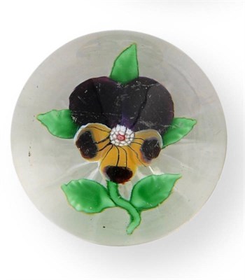 Lot 10 - A Baccarat Small Pansy Paperweight, circa 1850, the flowerhead with two upper mauve petals...