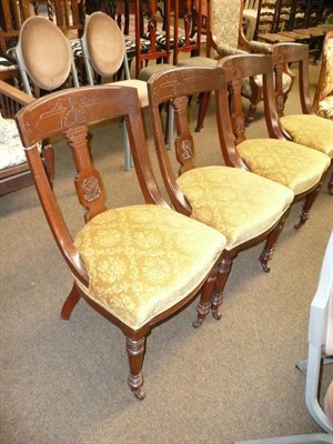 Lot 776 - An oak open arm chair with cane back and dining chair