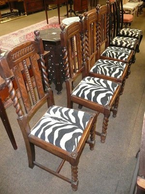 Lot 779 - Four oak dining chairs and two mahogany chairs covered to match