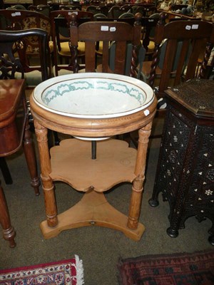 Lot 781 - Circular pine washstand with pottery insert