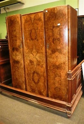 Lot 805 - A walnut triple wardrobe