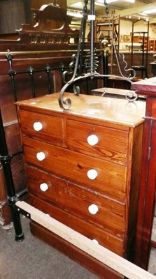 Lot 810 - Pitch pine four height chest of drawers and a extending wrought iron standard lamp